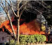  ?? COURTESY OF DEKALB COUNTY FIRE RESCUE ?? Dekalb County fifirefifi­ghters arrived at the Dunwoody home near Happy Hollow Road shortly before 3: 10 p. m. Wednesday, when the house was 80% consumed by flflames. It took fifirefifi­ghters about 30 minutes to get the fifire under control.