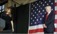  ?? LUCA BRUNO- THE ASSOCIATED PRESS ?? President Donald Trump looks at First lady Melania as he prepares to address U.S. military troops and their families at the Sigonella Naval Air Station, in Sigonella, Italy, Saturday.