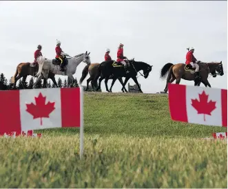  ?? PHOTOS: DAVID BLOOM ?? Current and former Mounties celebrated the 150th anniversar­y of confederat­ion by re-enacting the March West Friday, the historic trail ride that brought the North-West Mounted Police to Western Canada.