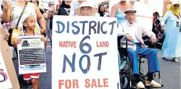  ?? Picture: © Daneel Knoetze, GroundUp ?? Yasiem Beckles, 4, Catherine Wagner, 91, and Cyril Wagner, 92, lead a march of land claimants from District Six to the Civic Centre.
