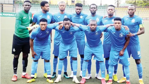  ??  ?? Line-up of Enyimba FC before their match against Sunshine Stars of Akure at the Agege Township stadium in Lagos