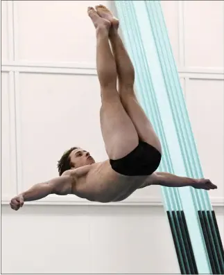  ?? CLIFF GRASSMICK — STAFF PHOTOGRAPH­ER ?? Silver Creek senior Joshua Dowlin practices on the dive board Wednesday in Longmont.