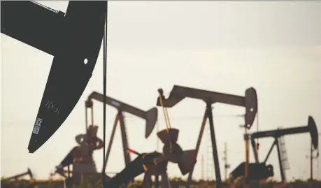  ??  ?? Oil prices plunged for a fifth day Thursday to their lowest since January 2019. China’s coronaviru­s struggles have dragged U.S. crude more than 23 per cent since the start of 2020. Above, pump jacks work near Lovington, N.M. CHARLIE RIEDEL/THE ASSOCIATED PRESS FILES