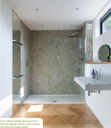  ??  ?? Colour Block Oak Blue Blend porcelain tiles from Mandarin Stone create a feature wall within the master ensuite
