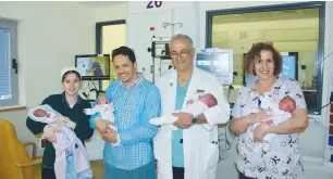  ?? (Courtesy) ?? AT THE CAPITAL’S Shaare Zedek Medical Center are (from left) the happy parents, Dr. Arnon Samueloff and Sarah Freund, a nurse in the premature-baby unit.