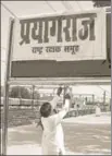  ?? PTI ?? Rashtriya Rakshak Samuh activists cover Allahabad Railway Junction board with a poster of ‘Prayagraj’