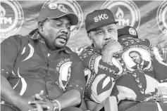  ??  ?? Chilima (right) listens to his party’s chairman Noel Masangwi (left) during the official launch of their United Transforma­tion Movement (UTM) at Masintha ground in the capital Lilongwe. — AFP photo