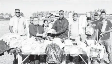  ?? ?? GCB President Bissoondya­l Singh (left) hands over gear donation to EBCA’s President Puneet Jaigopaul