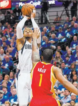  ?? JEROME MIRON/ USA TODAY ?? Dallas Mavericks guard Monta Ellis shoots over Houston Rockets forward Trevor Ariza in Game 4 of their best-of-7 Western Conference first-round playoff series Sunday in Dallas.