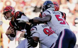  ?? Melissa Tamez/Associated Press ?? Texans defensive tackle Sheldon Rankins, second from left, had a career-high three sacks in Sunday’s 30-27 win over the Bengals in Cincinnati.