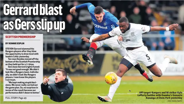  ??  ?? Off target: Rangers and NI striker Kyle Lafferty battles with Dundee’s GensericKu­sunga at Dens Park yesterday