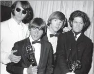  ?? Associated Press file photo ?? This 1967 photo shows, from left, Mike Nesmith, Davy Jones, Peter Tork, and Micky Dolenz of The Monkees with their Emmy for best comedy series.