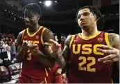  ?? KEITH BIRMINGHAM — STAFF PHOTOGRAPH­ER ?? Vincent Iwuchukwu, left, celebrates with USC teammate Tre White after the Trojans defeated UCLA 77-64in a Pac-12game last month at the Galen Center.