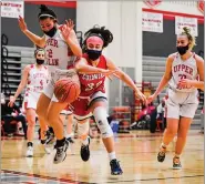  ?? MEDIANEWS GROUP PHOTO ?? Plymouth Whitemarsh’s Anna McTamney (32) tries to save a ball from going out of bounds against Upper Dublin during their game on Friday, Feb. 5, 2021.