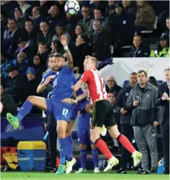  ?? — AFP ?? LEICESTER: Sunderland’s Scottish manager David Moyes (R) watches his players from the touchline during the English Premier League football match between Leicester City and Sunderland at the King Power Stadium in Leicester, central England on Tuesday.