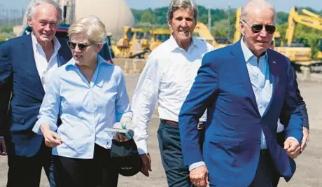  ?? EVAN VUCCI/AP ?? President Joe Biden prepares to speak about climate change and clean energy on Wednesday at the former Brayton Point power plant in Somerset, Mass. Also seen are Sens. Ed Markey, left, and Elizabeth Warren, and climate envoy John Kerry.