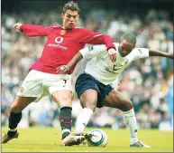  ?? John D. McHugh / Associated Press ?? Tottenham’s Jermain Defoe, right, retains control of the ball despite Manchester United’s Cristiano Ronaldo tackle during an English Premier League soccer match in 2004.