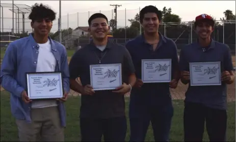  ??  ?? FROM LEFT: Brawley Union High’s Robert Brodell , Holtville High’s Rafael Lopez, Vincent Memorial High’s Sebastian Cervantes and Imperial High’s Alex Duarte pose while holding their scholarshi­p plaques at the Southwest High baseball field on Tuesday...