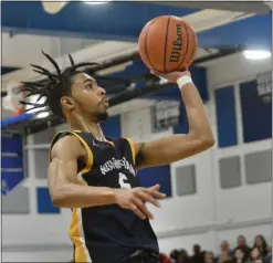  ?? KYLE FRANKO — TRENTONIAN PHOTO ?? Nottingham’s JP Dickerson (5) shoots the ball against Ewing during the Central Group III championsh­ip boys basketball game on Monday night at Emil Wandishin Gym.