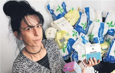  ?? Picture: Mhairi Edwards. ?? Jane Mclean with the unused prescripti­on drugs she found when she moved into her new house.