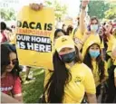  ?? J. SCOTT APPLEWHITE/AP ?? Susana Lujano, left, a dreamer from Mexico who lives in Houston, joins other activists to rally in support of the Deferred Action for Childhood Arrivals program, also known as DACA, at the U.S. Capitol in Washington on June 15.