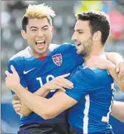  ?? Harry How ?? STEVE BIRNBAUM, right, celebrates with Lee Nguyen after scoring against Iceland last Sunday.