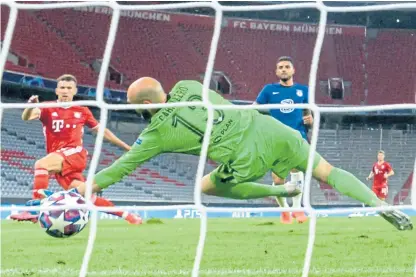  ?? Picture: PA. ?? Ivan Perisic beats Chelsea keeper Willy Caballero to give Bayern a 2-0 lead at the Allianz Arena.