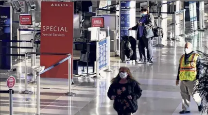  ??  ?? Passengers and staff make their way through the the terminal at Albany Internatio­nal Airport on Thursday.