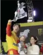  ?? TERRY RENNA — THE ASSOCIATED PRESS ?? Joey Logano celebrates his wife Brittany Baca and son Hudson after winning the Monster Energy Cup Series Championsh­ip on Nov. 18 at Homestead-Miami Speedway.