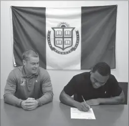  ?? Photo courtesy of Blair Academy ?? St. Raphael product Alfred Dorbor (right) signs a National Letter of Intent to play at Bryant University with Blair Academy coach Jim Stone (left) looking on.