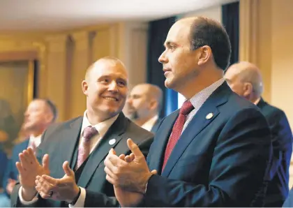  ?? DAILY PRESS FILE ?? Republican Del. David Yancey, right, applauds in 2018. Yancey is pitching an alternativ­e to the gun legislatio­n of Gov. Ralph Northam, suggesting that a strategy used federally of cutting convicts’ sentences in exchange for informatio­n on gun-runners could help cut down on gun violence.