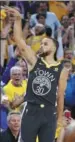  ?? EZRA SHAW / GETTY IMAGES / AFP ?? Stephen Curry of the Golden State Warriors reacts to draining a 3-pointer against the New Orleans Pelicans on Tuesday night in Oakland.