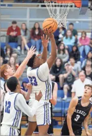  ?? Barbara hall ?? Gordon Central forward DJ Fleetwood goes up for a basket against Fannin County Monday night in the Region 7-2A tournament at GCHS.