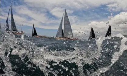  ?? Photograph:Mark Evans/Getty Images ?? The fleet sails out of the heads during the 2021 Sydney to Hobart yacht race start.