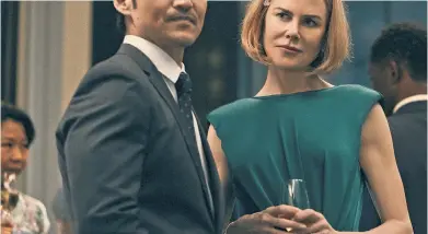  ?? ?? Above: Brian Tee and Kidman as Clarke and Margaret as the series opens in Hong Kong in 2014.