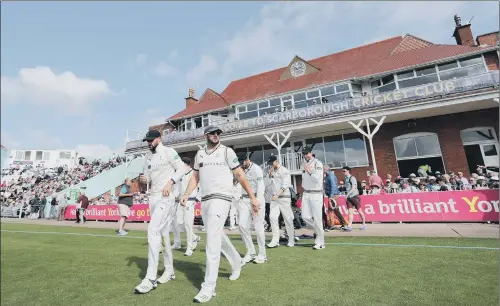  ?? PICTURE: SWPIX.COM ?? WARM RECEPTION: Yorkshire players walk out of the pavilion onto the field ahead at Scarboroug­h last year ahead of the game with Nottingham­shire.