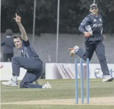  ??  ?? 0 Chris Sole, left, sends the bails flying as he brilliantl­y runs out Namibia’s Jan Frylinck yesterday.