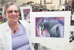  ??  ?? Animal magic: Lesley Ann Sharp and (below) working on her painting