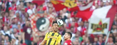  ?? MICHAEL DALDER / REUTERS ?? Borussia Dortmund’s Pierre-Emerick Aubameyang (left) outleaps Bayern Munich’s Xabi Alonso for a header during their Bundesliga match at Allianz Arena, Munich, on Saturday. Bayern won 4-1.