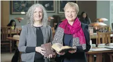  ?? DON ERHARDT ?? Siân Echard, head of UBC’s department of English, left, and Ingrid Parent, UBC’s university librarian hold the two ancient manuscript­s.