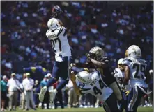  ??  ?? Los Angeles Chargers defensive back Jaylen Watkins (27) intercepts a pass during the first half of a preseason NFL football game against the New Orleans Saints, on Aug. 18, in Carson. Calif.
AP PHOTO/KElVIN KUO