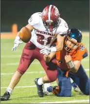  ?? NWA Democrat-Gazette/CHARLIE KAIJO ?? Rogers Heritage linebacker Nathan Mireles (46) breaks up a pass intended for Springdale High’s Heriberto Gutierrez on Friday in Rogers.