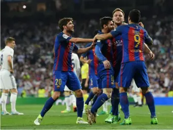  ?? (Getty) ?? Barcelona celebrate after Messi's first goal