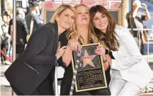  ?? RICHARD SHOTWELL/INVISION/AP PHOTO BY ?? Actress Christina Applegate (center) poses with “Dead to Me” creator Liz Feldman (left) and her “Dead to Me” co-star Linda Cardellini during a ceremony honoring Applegate with a star on the Hollywood Walk of Fame on Nov. 14, 2022, in Los Angeles.