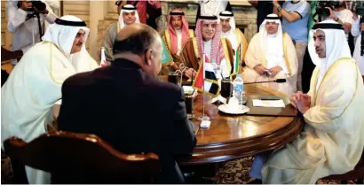  ?? AFP ?? CAIRO MEET: UAE’s Sheikh Abdullah bin Zayed Al Nahyan, Saudi Arabia’s Adel Al Jubeir, Bahrain’s Sheikh Khalid bin Ahmed Al Khalifa and Egypt’s Sameh Shoukry discuss the Qatar issue during the foreign ministers’ meet in Cairo on Wednesday. —