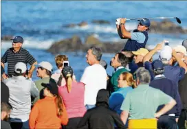  ?? MIKE EHRMANN / GETTY IMAGES ?? Phil Mickelson tees off at the 13th tee during his round of 6-under 65 at Monterey Peninsula Country Club to leave him three off the pace.