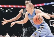  ?? N.Y. Post: Charles Wenzelberg ?? OH, HENRY! Marquette’s Henry Ellenson drives to the basket in Tuesday’s win over Arizona State at Barclays Center.