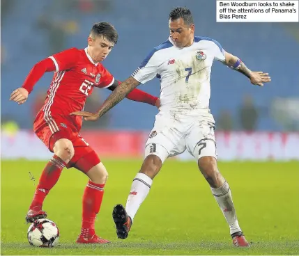  ??  ?? Ben Woodburn looks to shake off the attentions of Panama’s Blas Perez