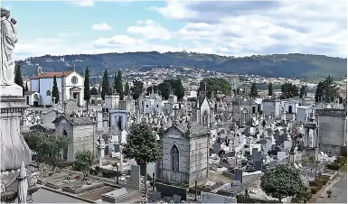  ?? ?? ABOVE: The Cemetery of Monte d’Arcos, Braga, Portugal, where Angela Silva Bessa (pictured at bottom) found a mummificat­ion mystery. BELOW: Senai assemblyma­n Wong Bor Yang (left) with the legally dead Low Choo Choon.