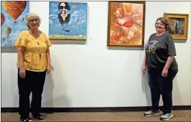  ?? Jeremy Stewart ?? Rockmart Cultural Arts Center Director Peggy Cline (left) and local artist Kim Gray stand alongside some of the paintings that are part of the center gallery’s juried art exhibit at the City of Rockmart complex at 316 N. Piedmont Ave.
